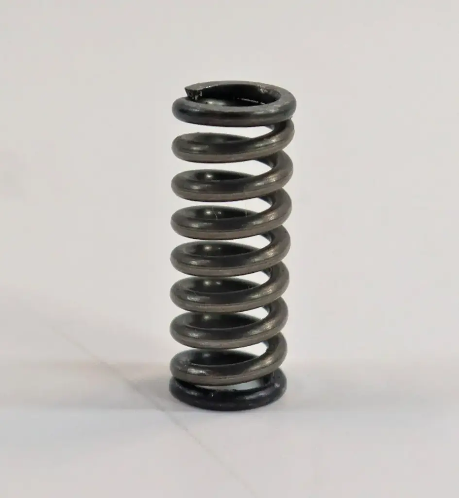 SPRING UNDER TRANSMISSION SHIFT COVER ON MAHINDRA TRACTOR (006502304R1)